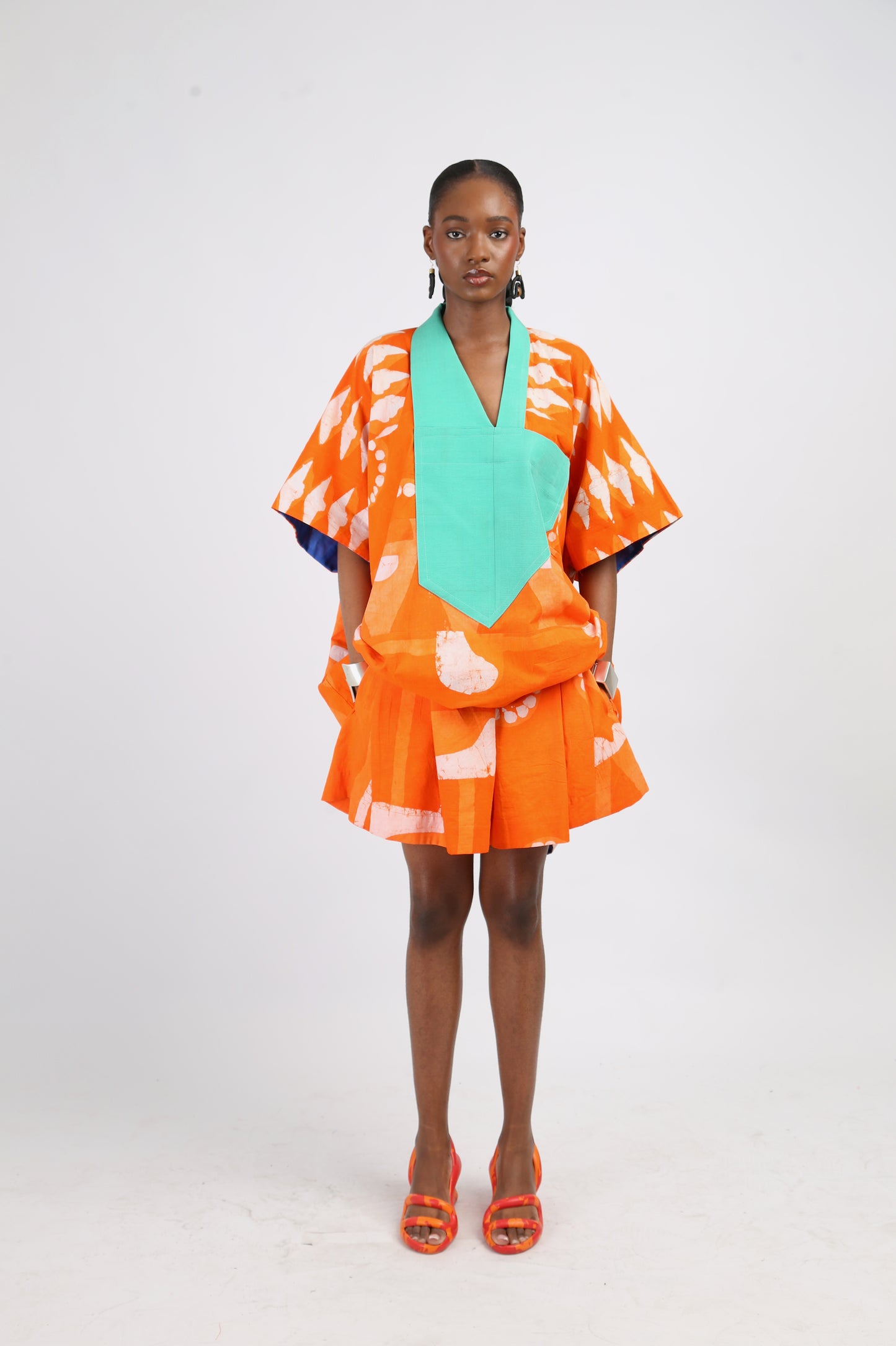 WHITE AND TANGERINE MULTIPRINT WIDE LEG SHORTS