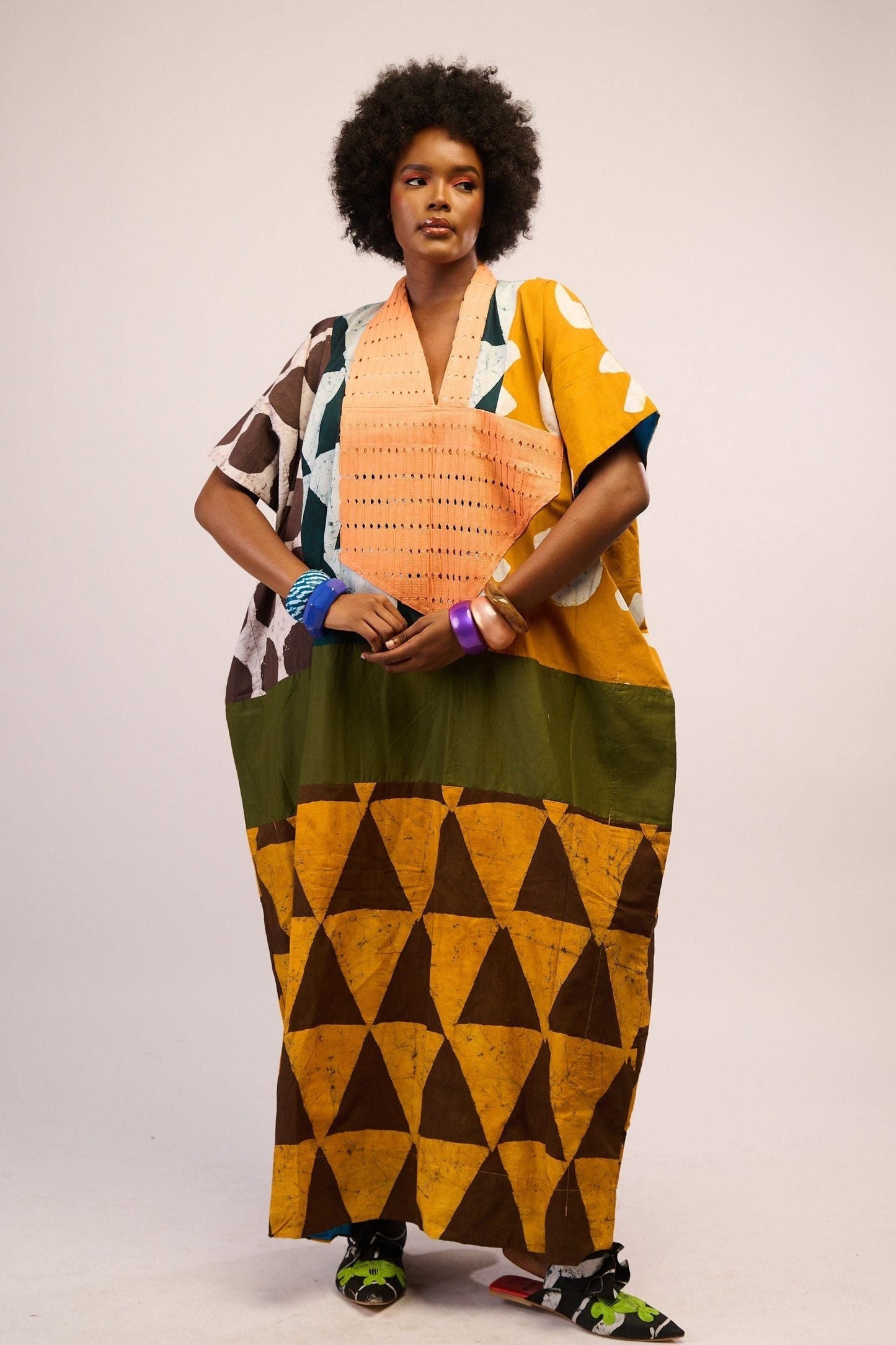 BRIGHT MULTICOLOURED AGBADA WITH YELLOW AND BROWN BOTTOM AND PEACH ASOOKE WITH HOLES