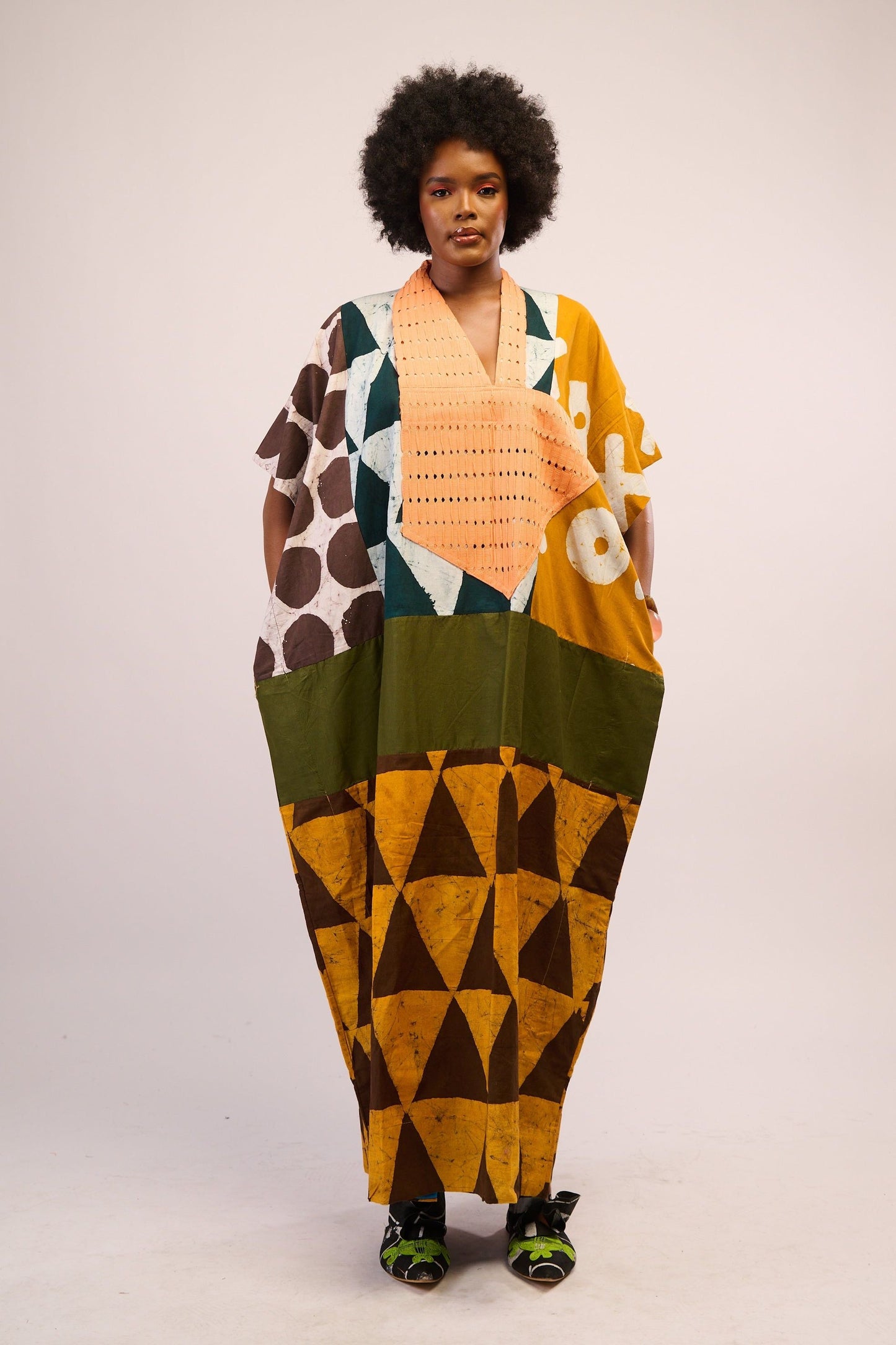 BRIGHT MULTICOLOURED AGBADA WITH YELLOW AND BROWN BOTTOM AND PEACH ASOOKE WITH HOLES