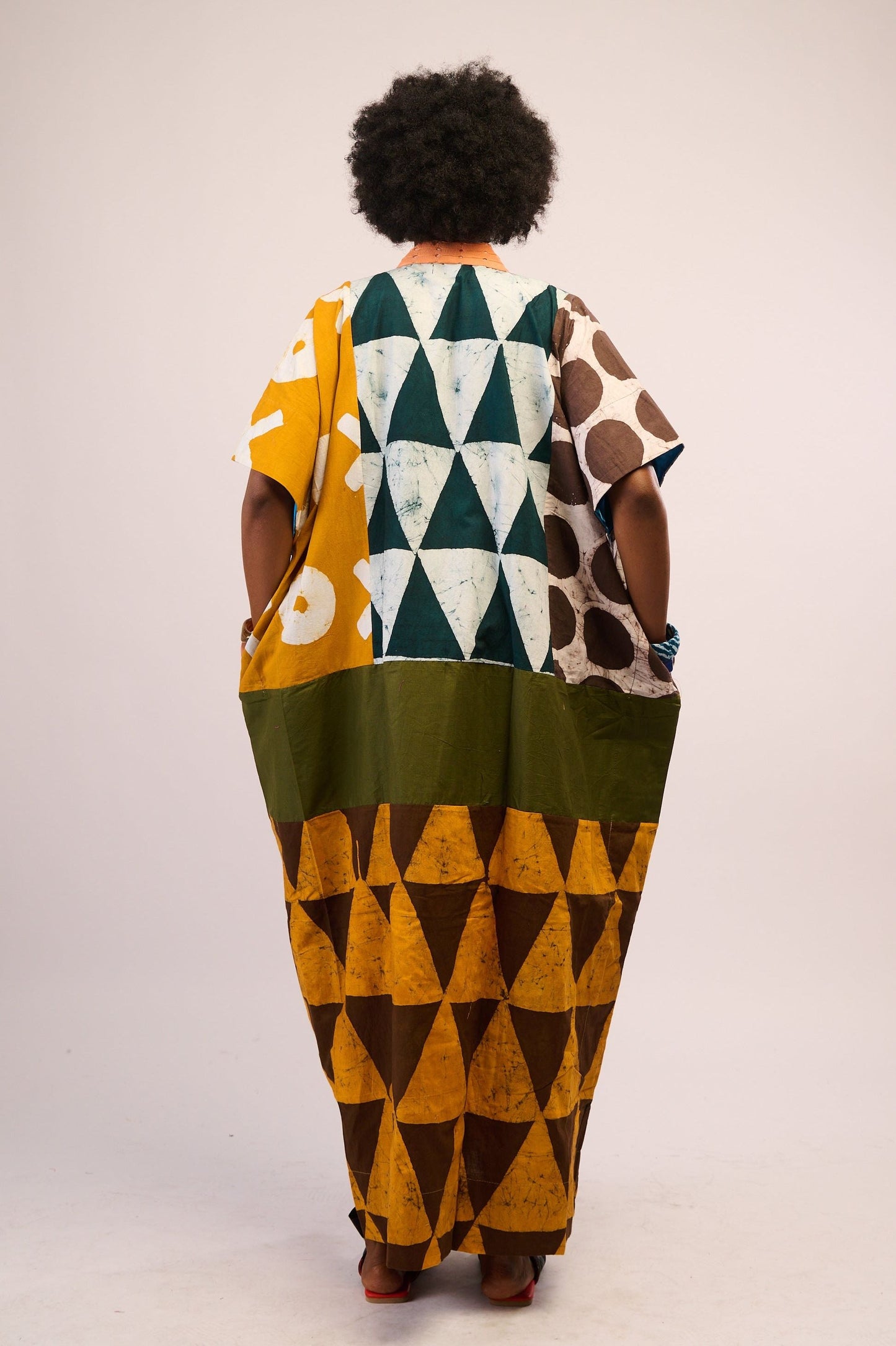 BRIGHT MULTICOLOURED AGBADA WITH YELLOW AND BROWN BOTTOM AND PEACH ASOOKE WITH HOLES